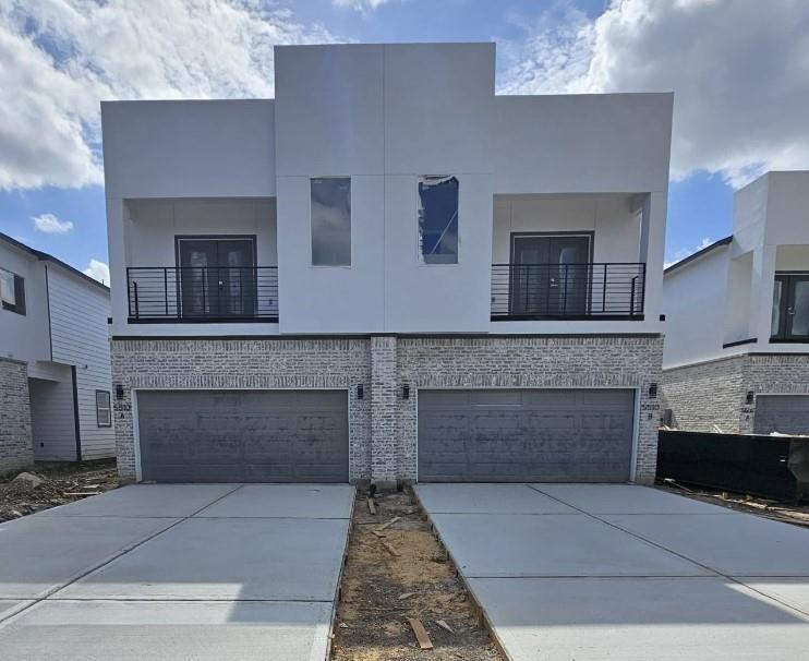 a front view of a house with yard