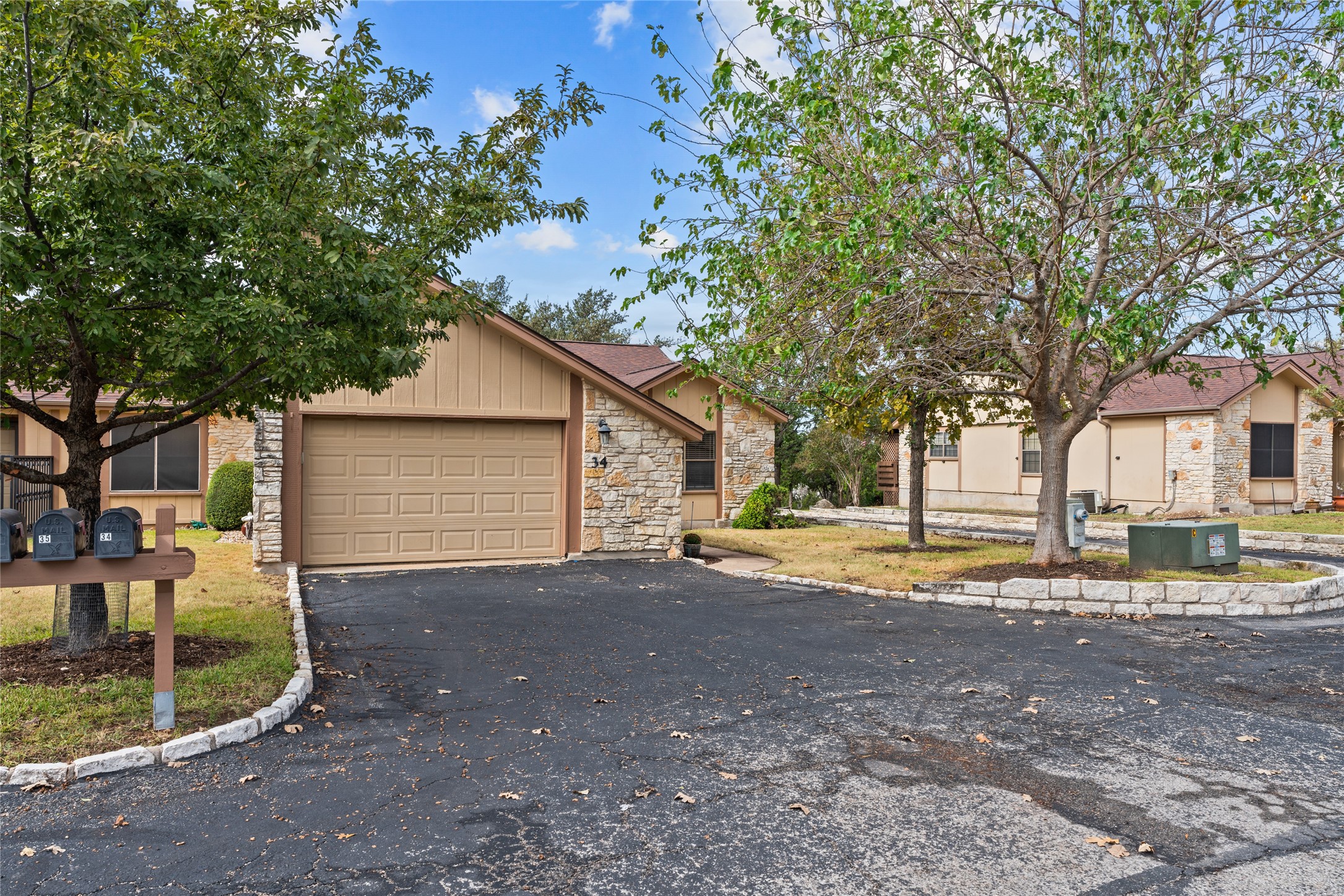 a view of a house with a yard and garage