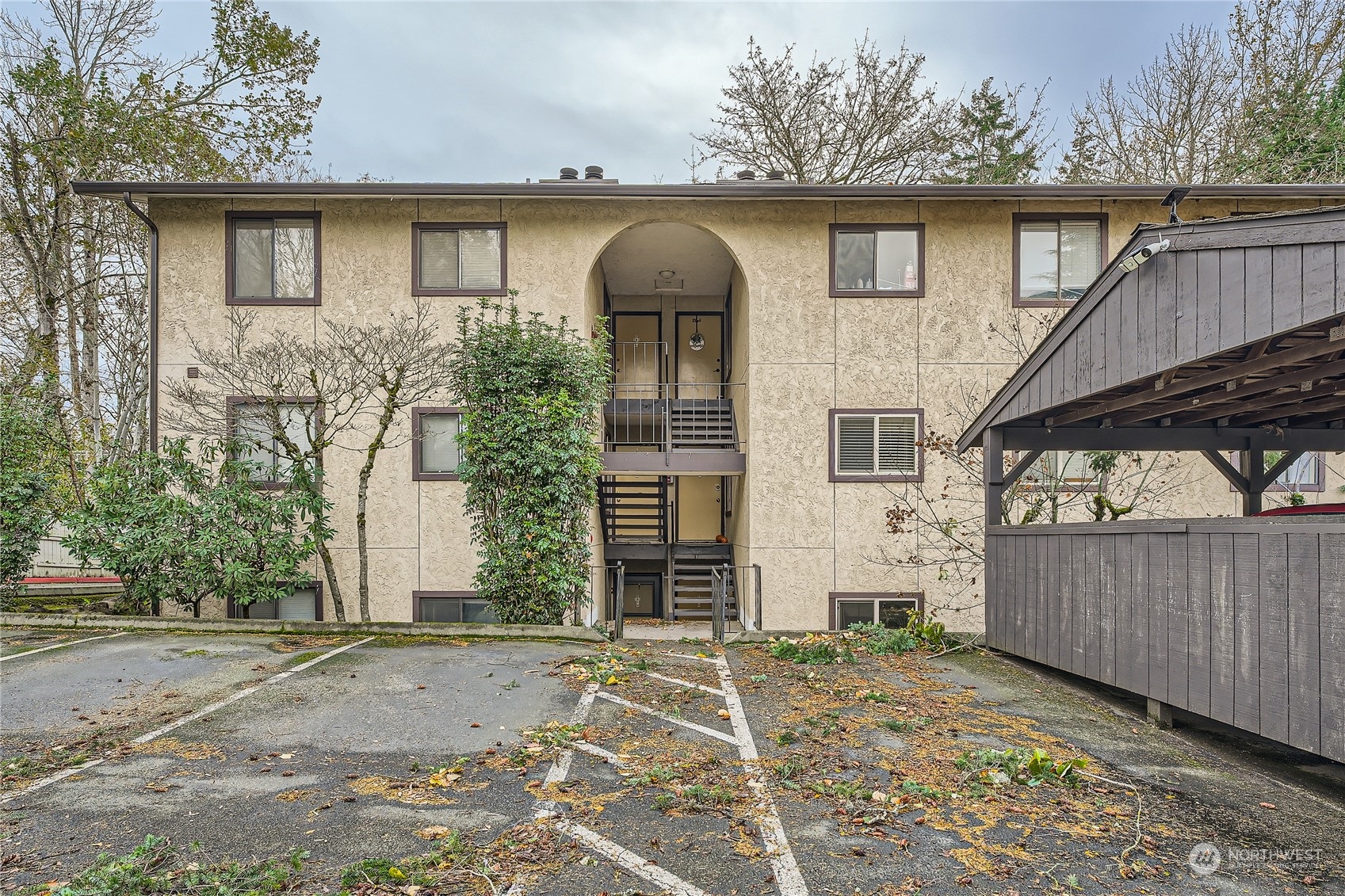 a front view of a house with parking space