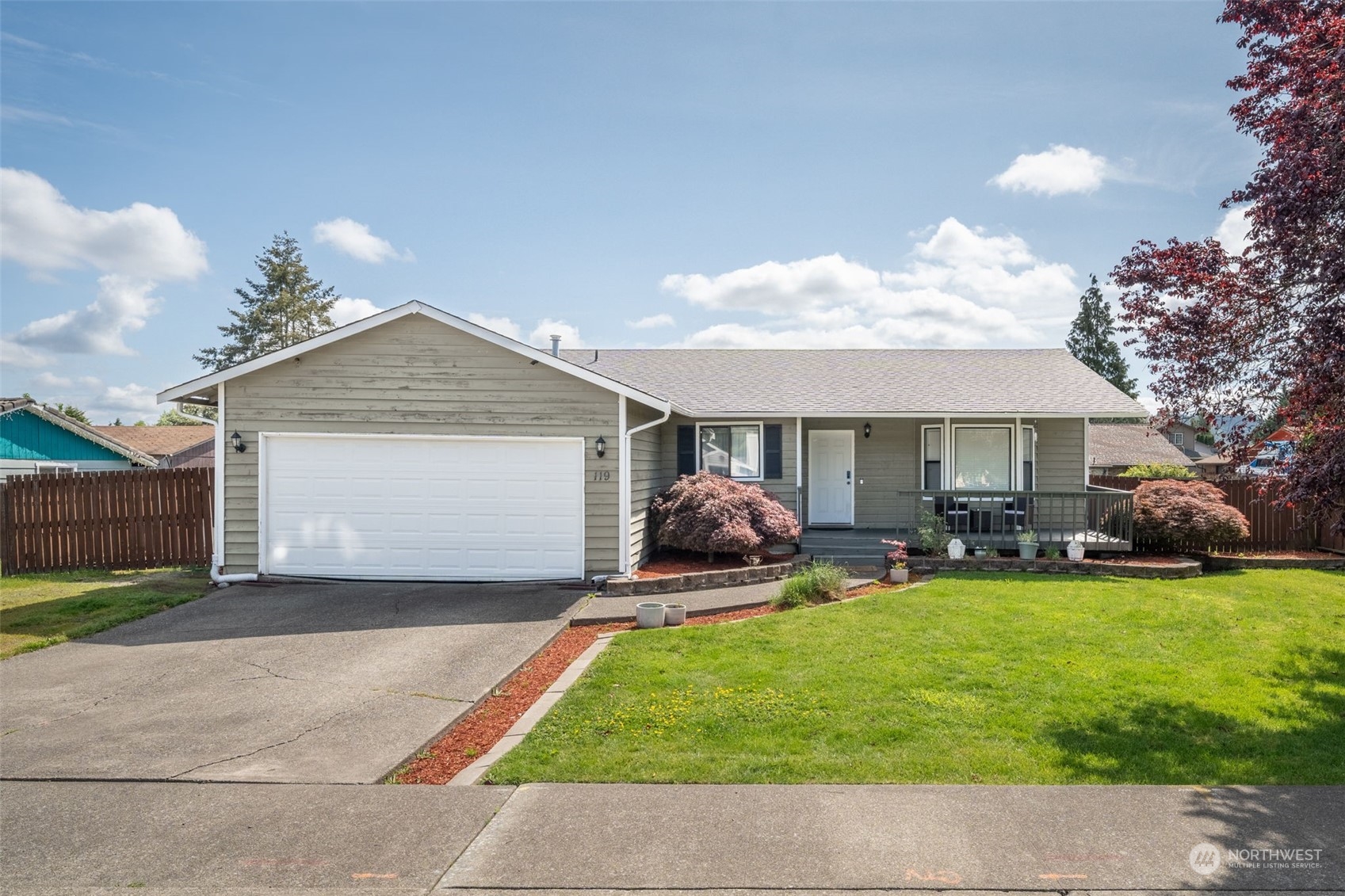 a front view of house with yard and outdoor seating