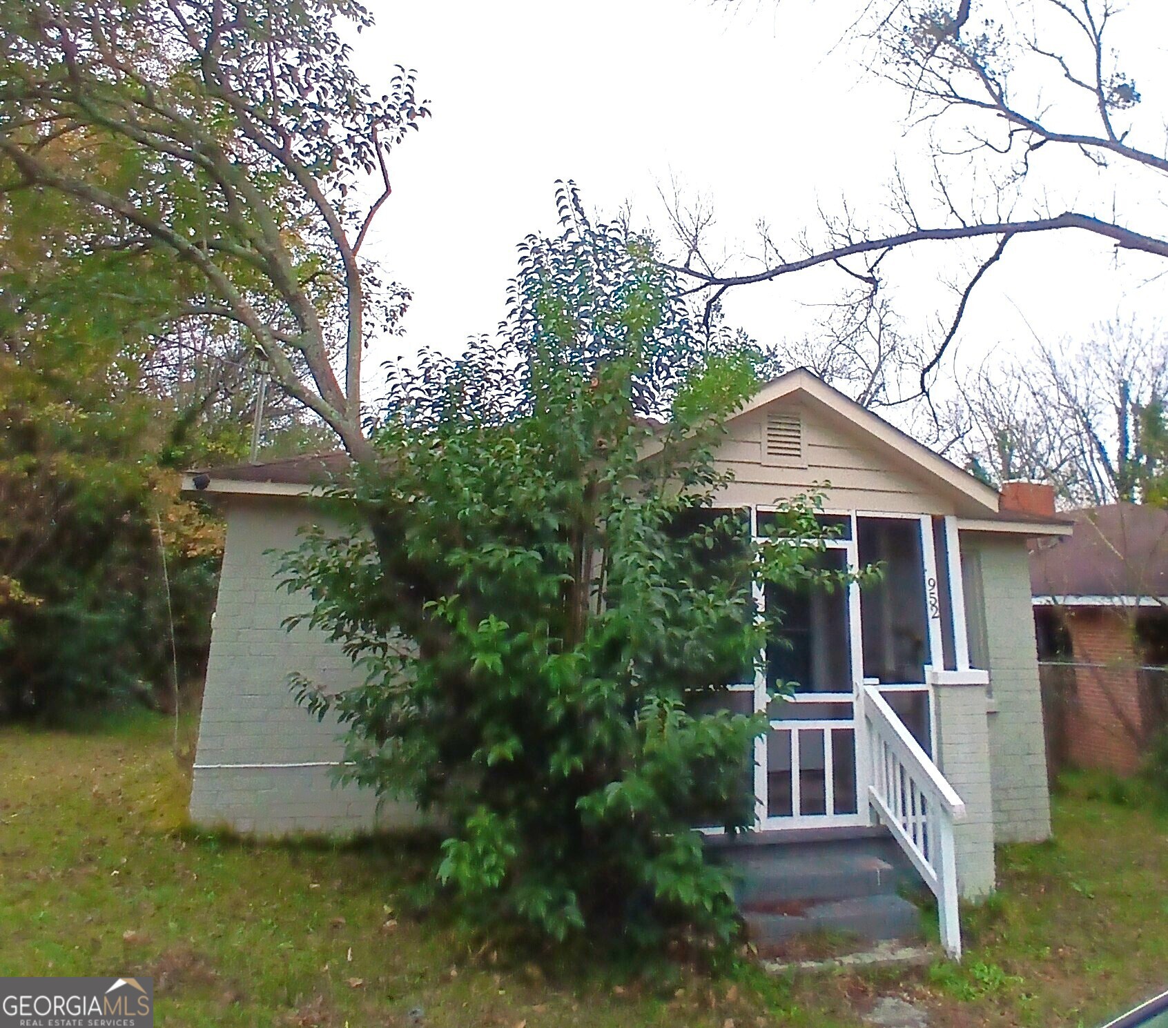 a house that has tree in front of it