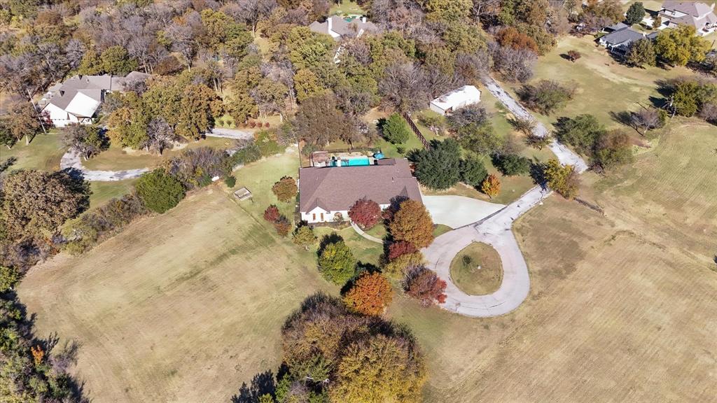 a aerial view of a house with a yard