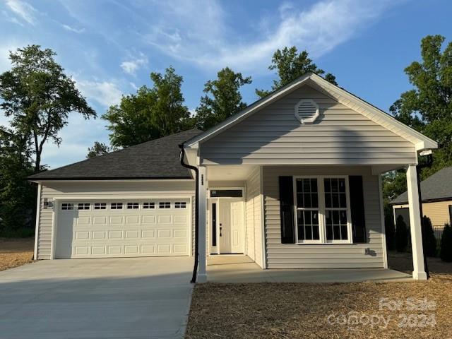 a front view of a house with a garage