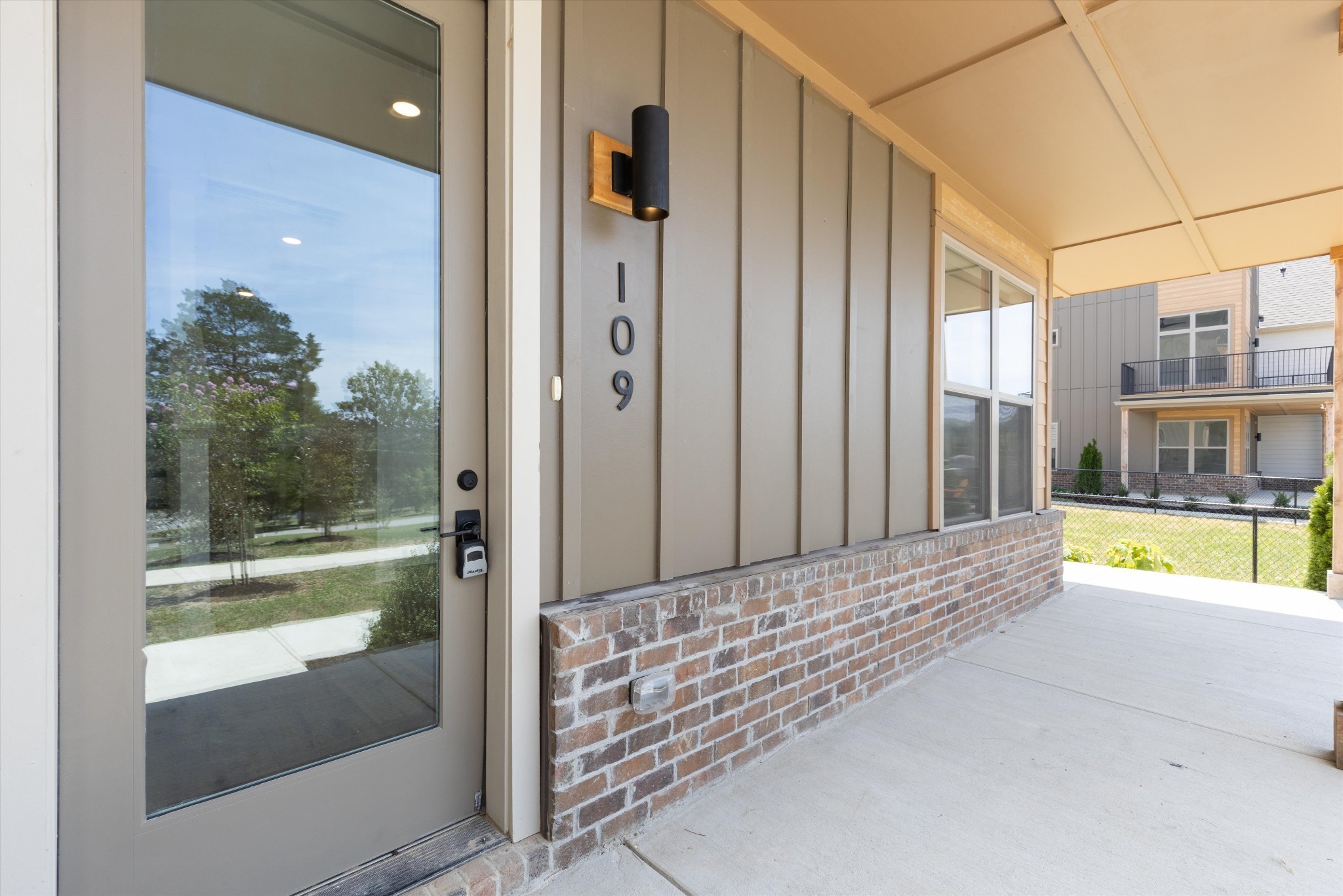 Large wrap-around front porch, perfect for rocking chairs and a swing. This unit is just off the community area featuring grilling area, fire pits and fenced dog park.