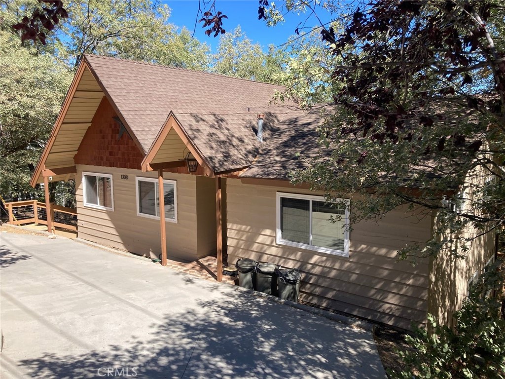 a front view of a house with yard and seating area