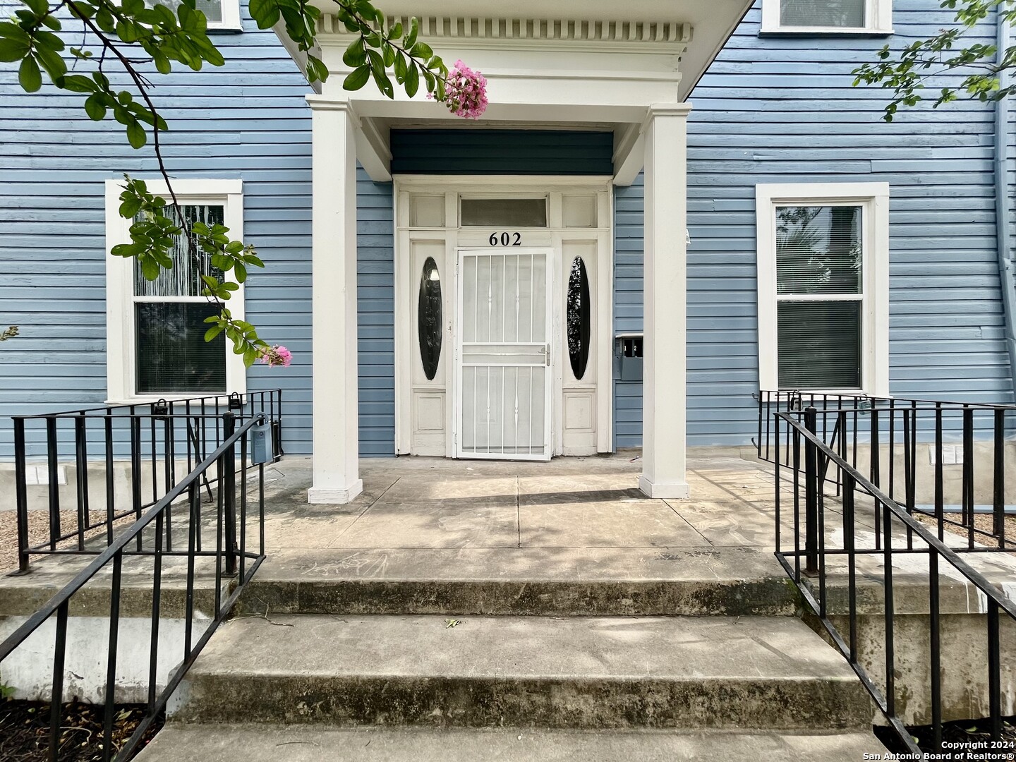 a front view of a house with a garage