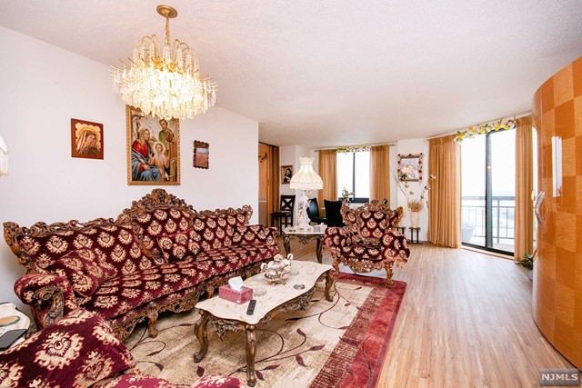 a bed room with a bed and a chandelier