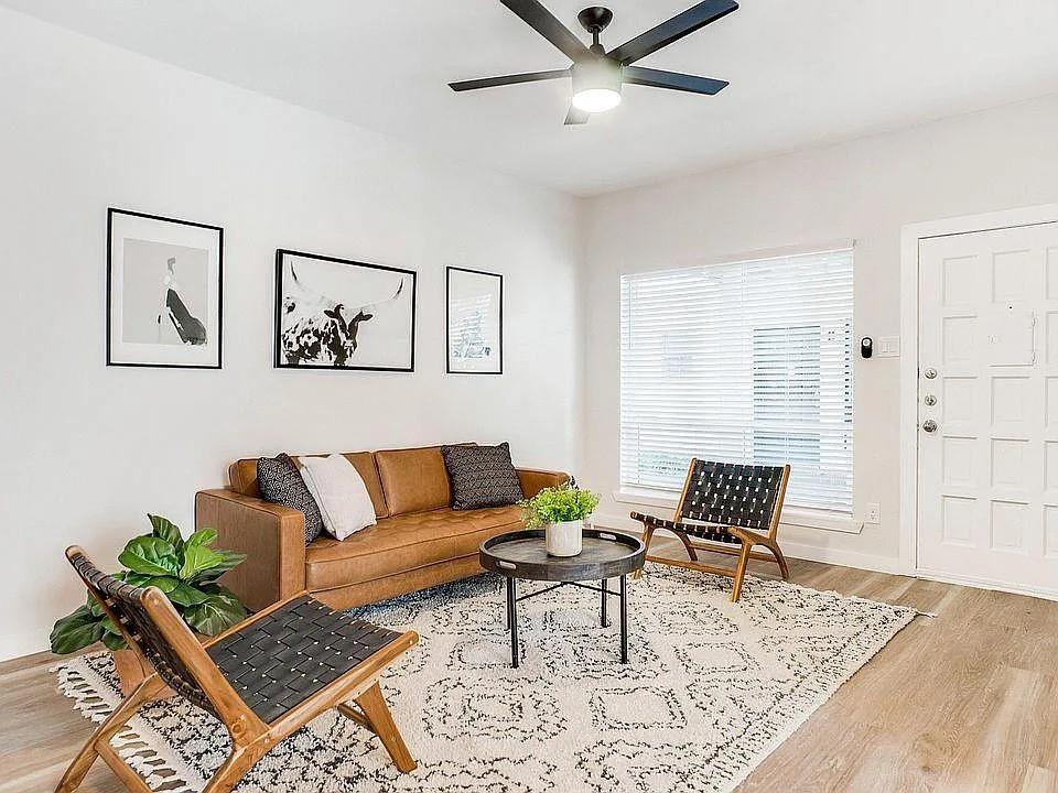 a living room with furniture and rug