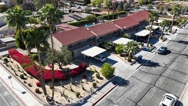 an aerial view of a house with garden space and street view