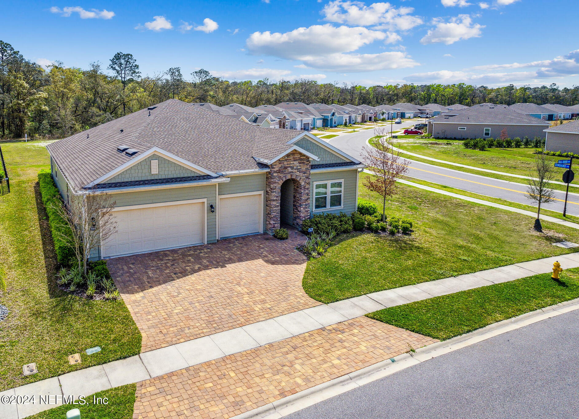 an aerial view of a house with a garden