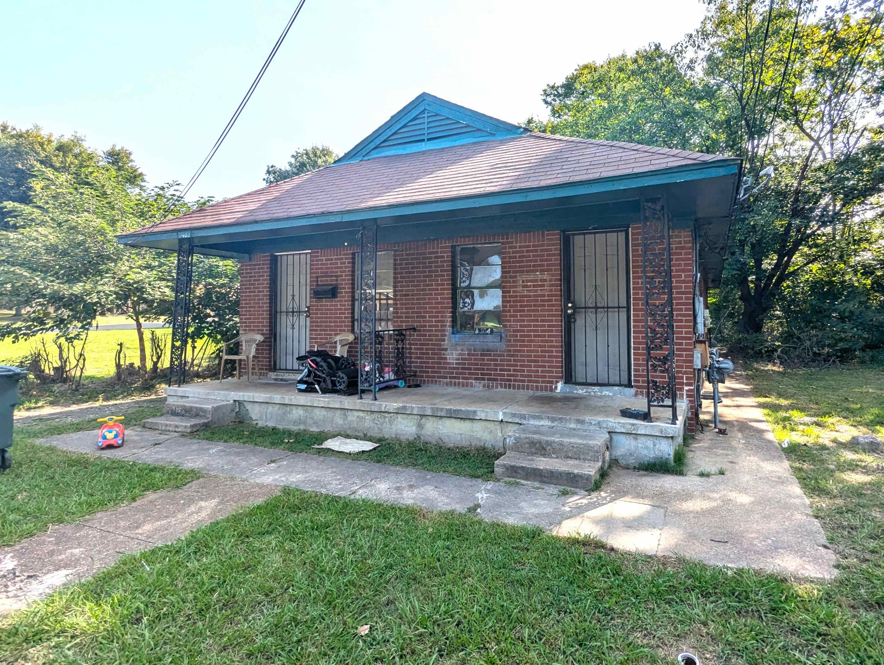 Bungalow-style home with a porch and a front yard