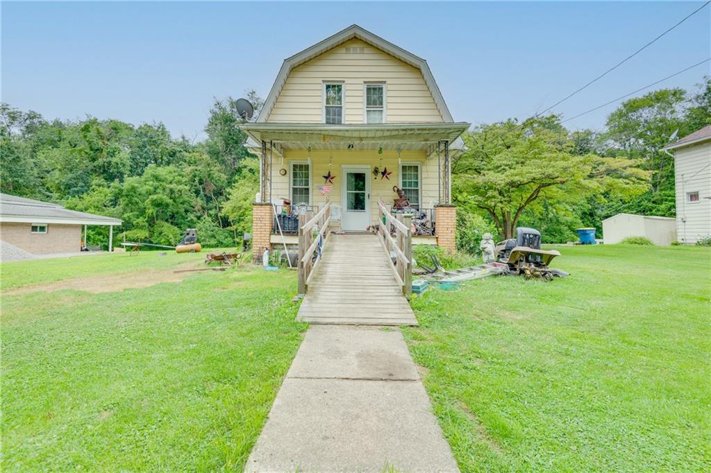 a front view of a house with a yard