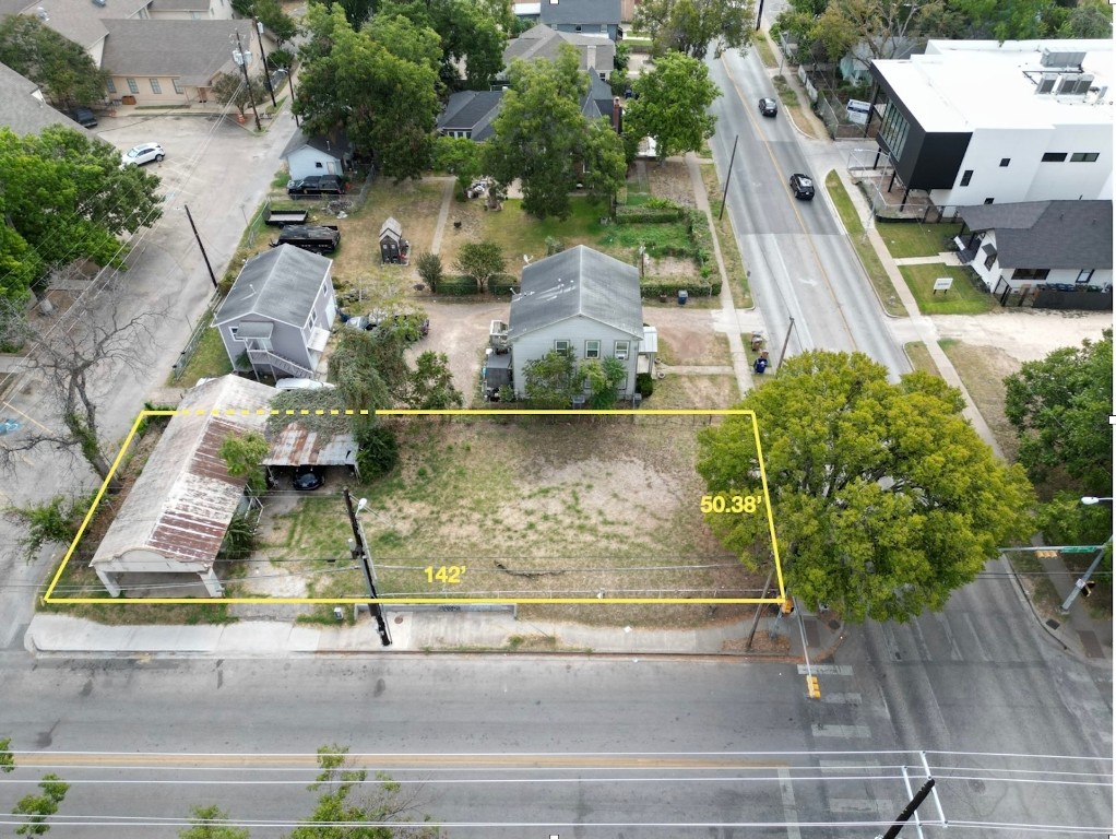 an aerial view of residential houses with outdoor space