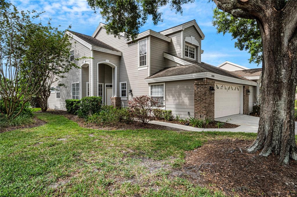 a front view of a house with a yard