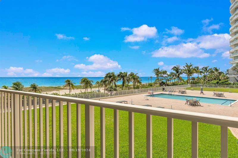 a view of a balcony with an ocean view