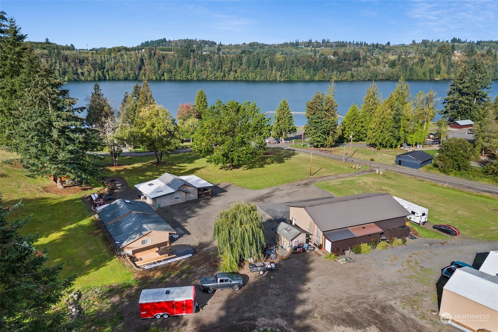 an aerial view of a house with outdoor space and lake view