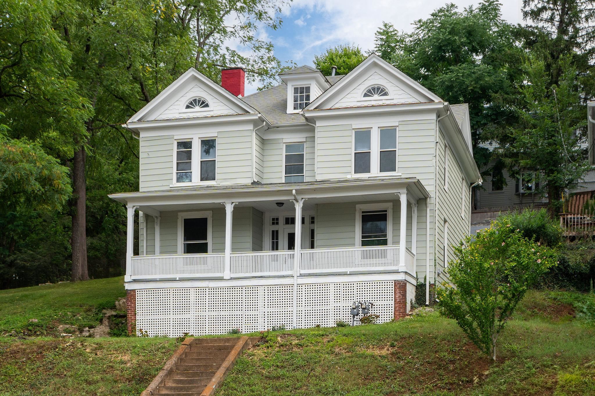 a view of house with yard