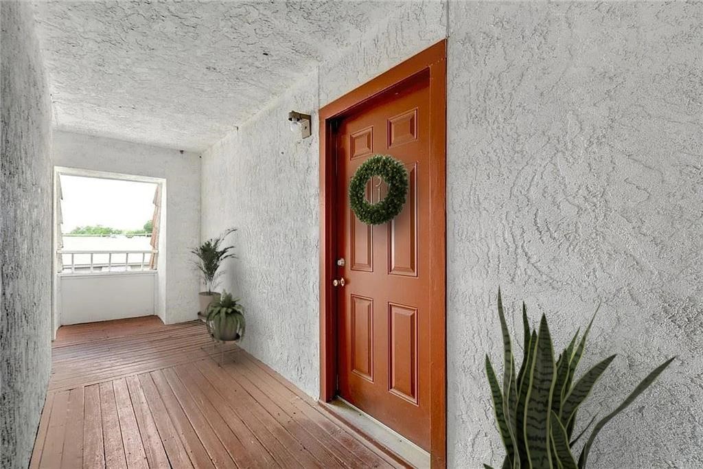 a view of entryway with wooden floor