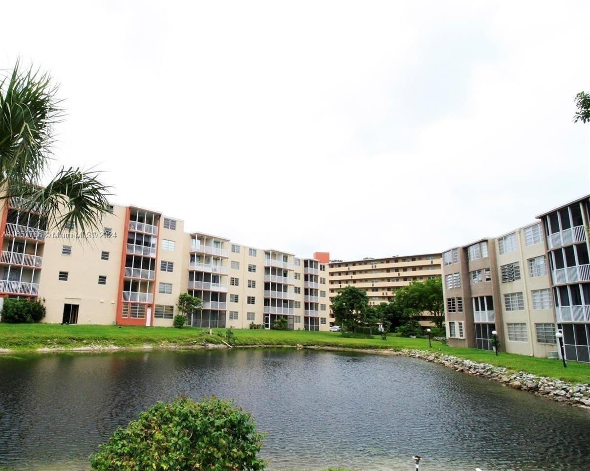 a view of a lake with a big building