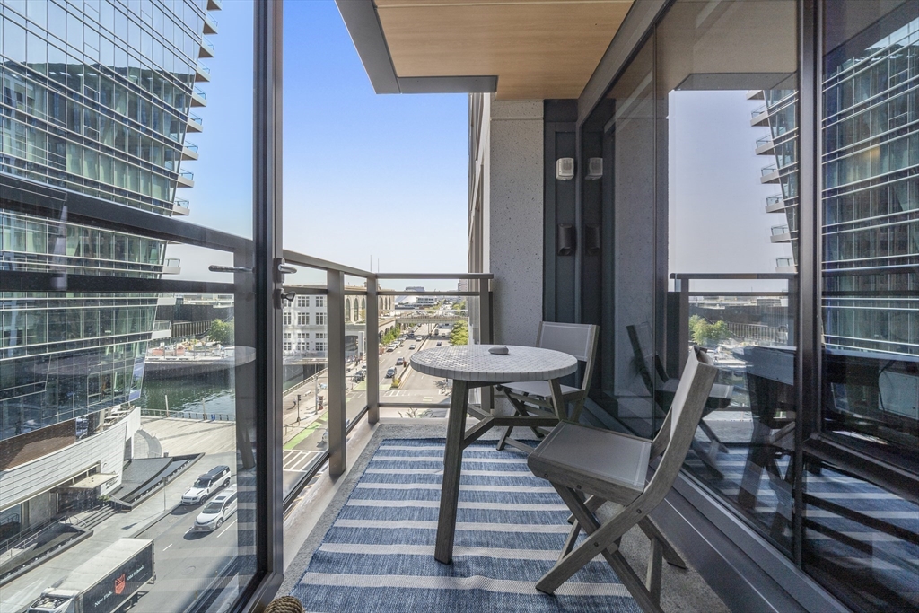 a view of balcony and wooden floor