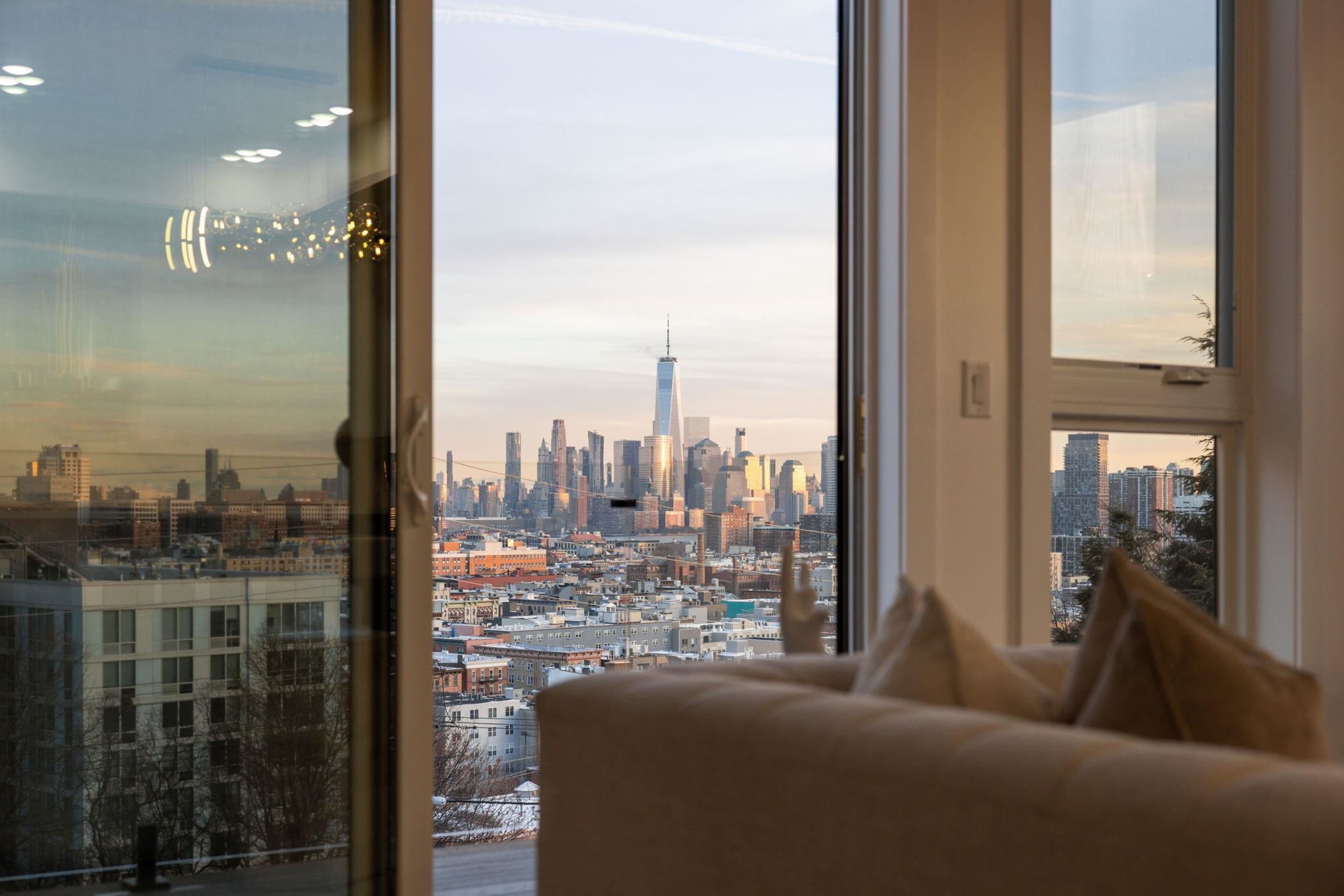 a view of a city from a corridor