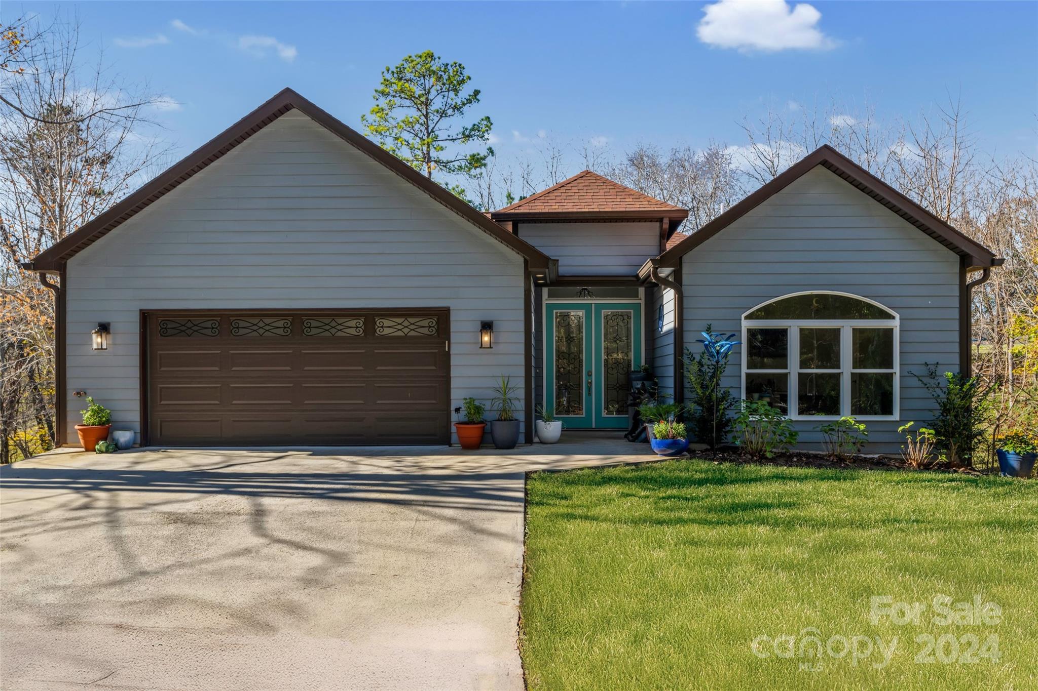 a front view of a house with a yard