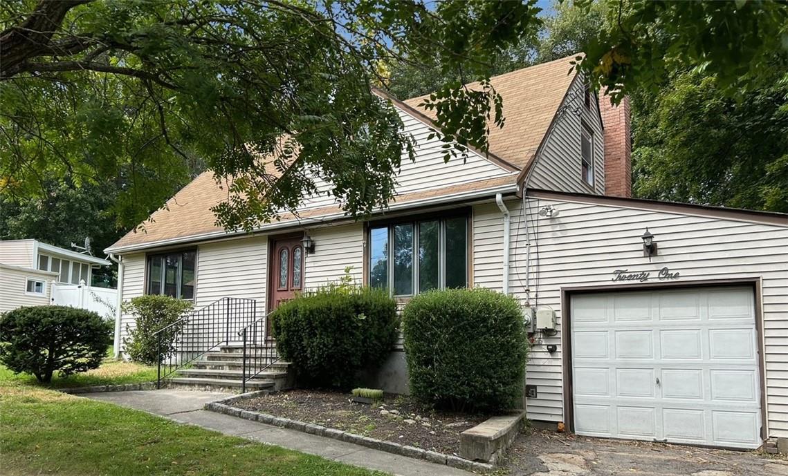 View of front of property featuring a garage