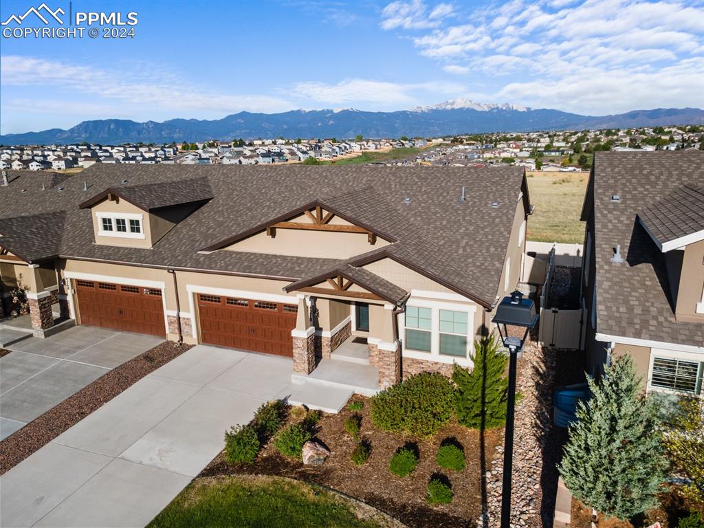 an aerial view of a house with a lake view