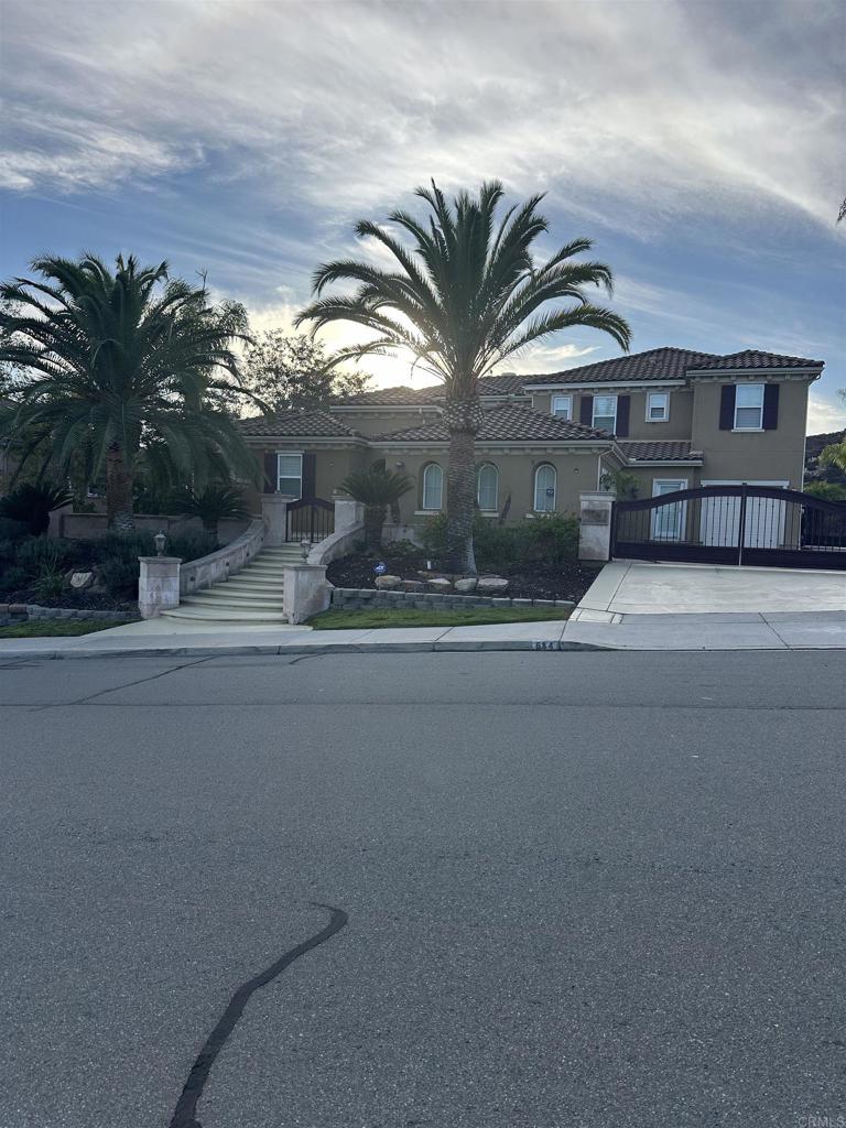 a picture of a house with a street