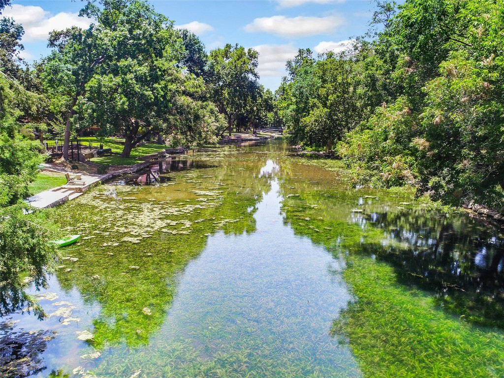 a view of a lake with a yard