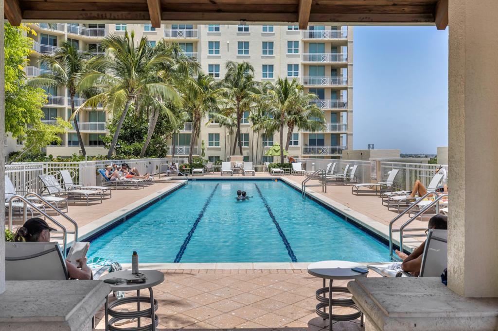 a view of swimming pool with outdoor seating