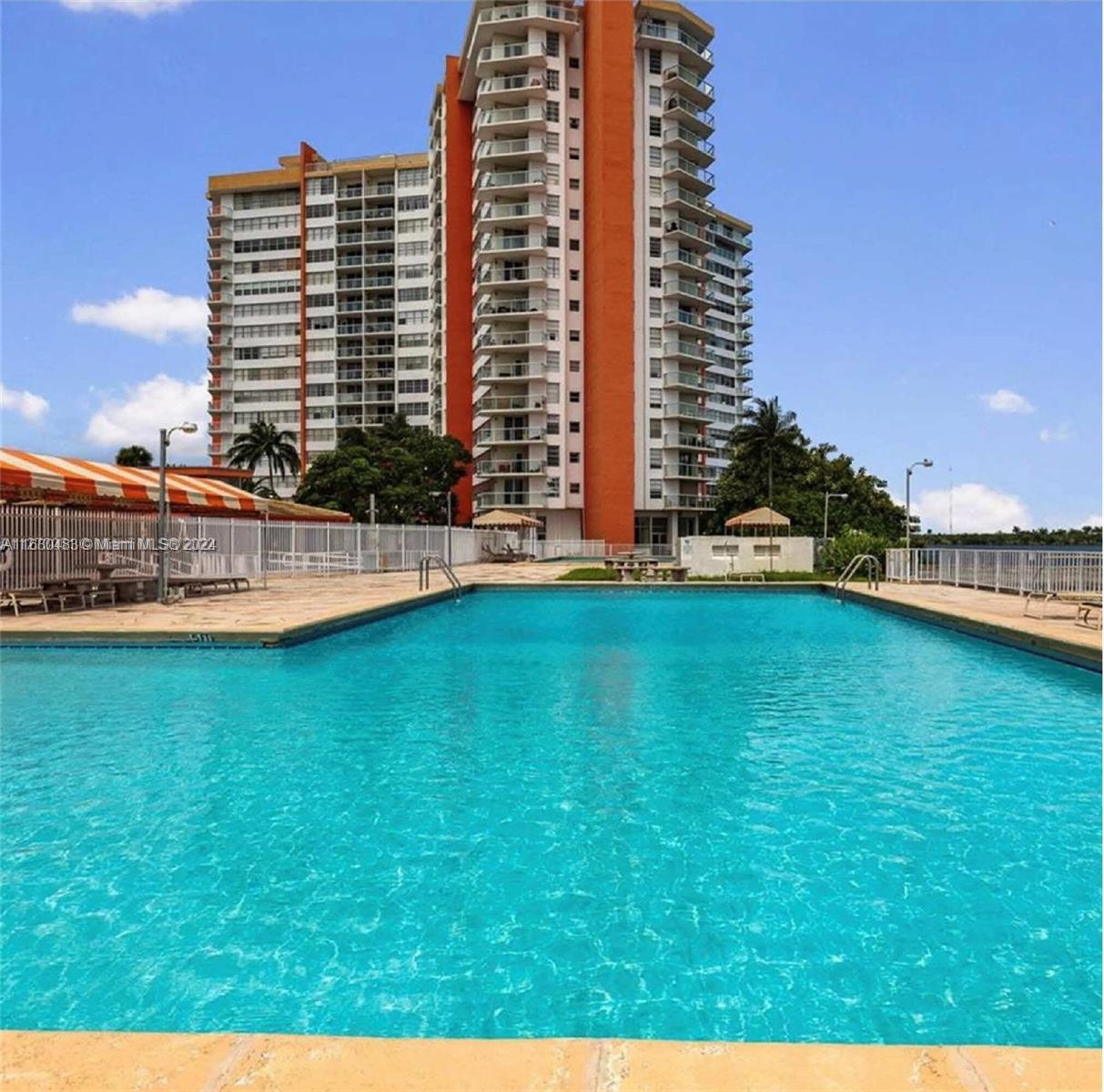 a view of outdoor space with swimming pool and lake view