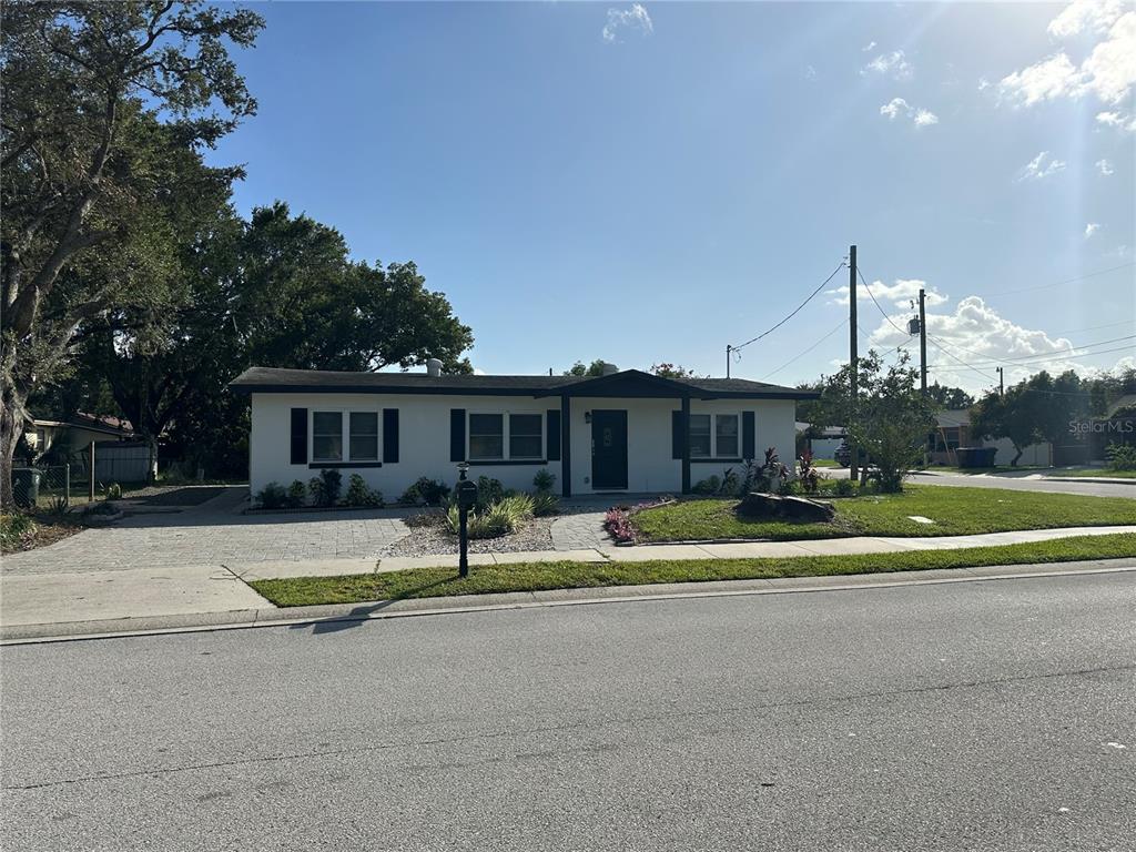 a house with trees in the background