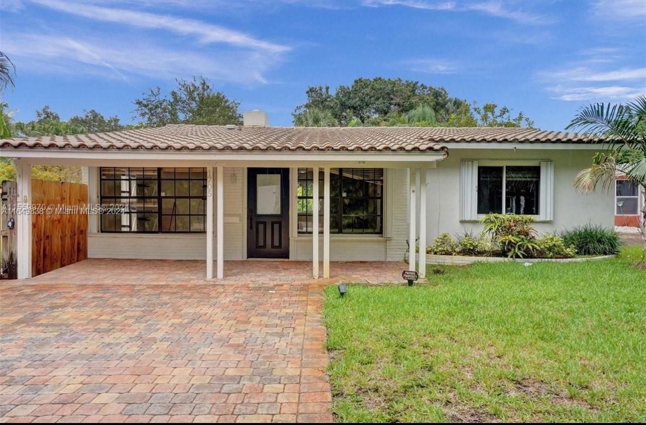 front view of a house with a yard