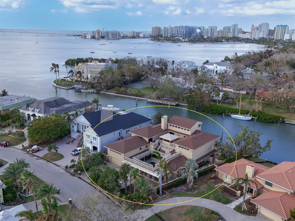 an aerial view of a house with outdoor space and lake view