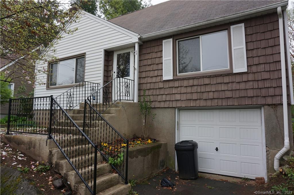 a front view of a house with garage