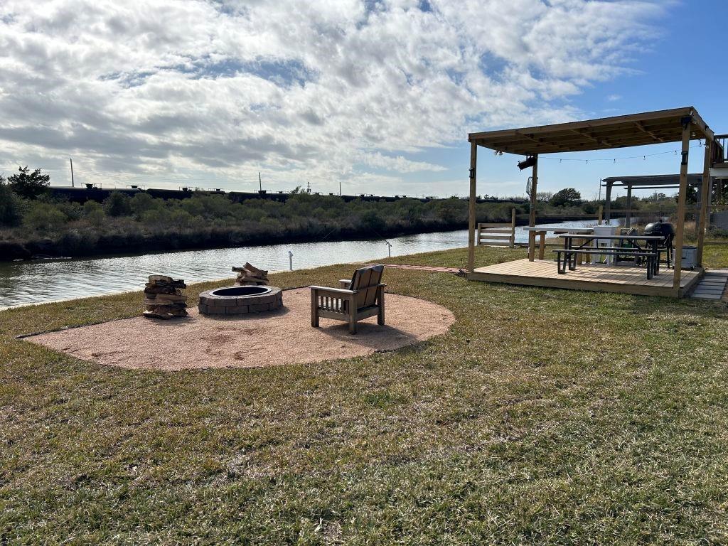 a view of swimming pool with outdoor seating