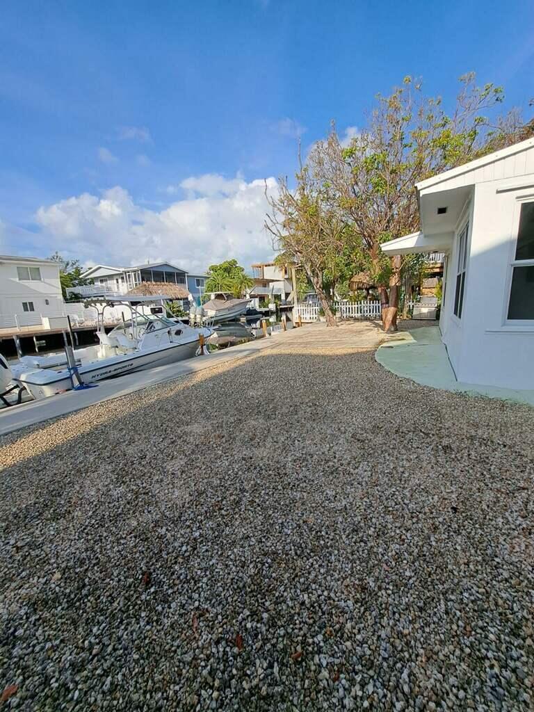 a view of a yard with car parked