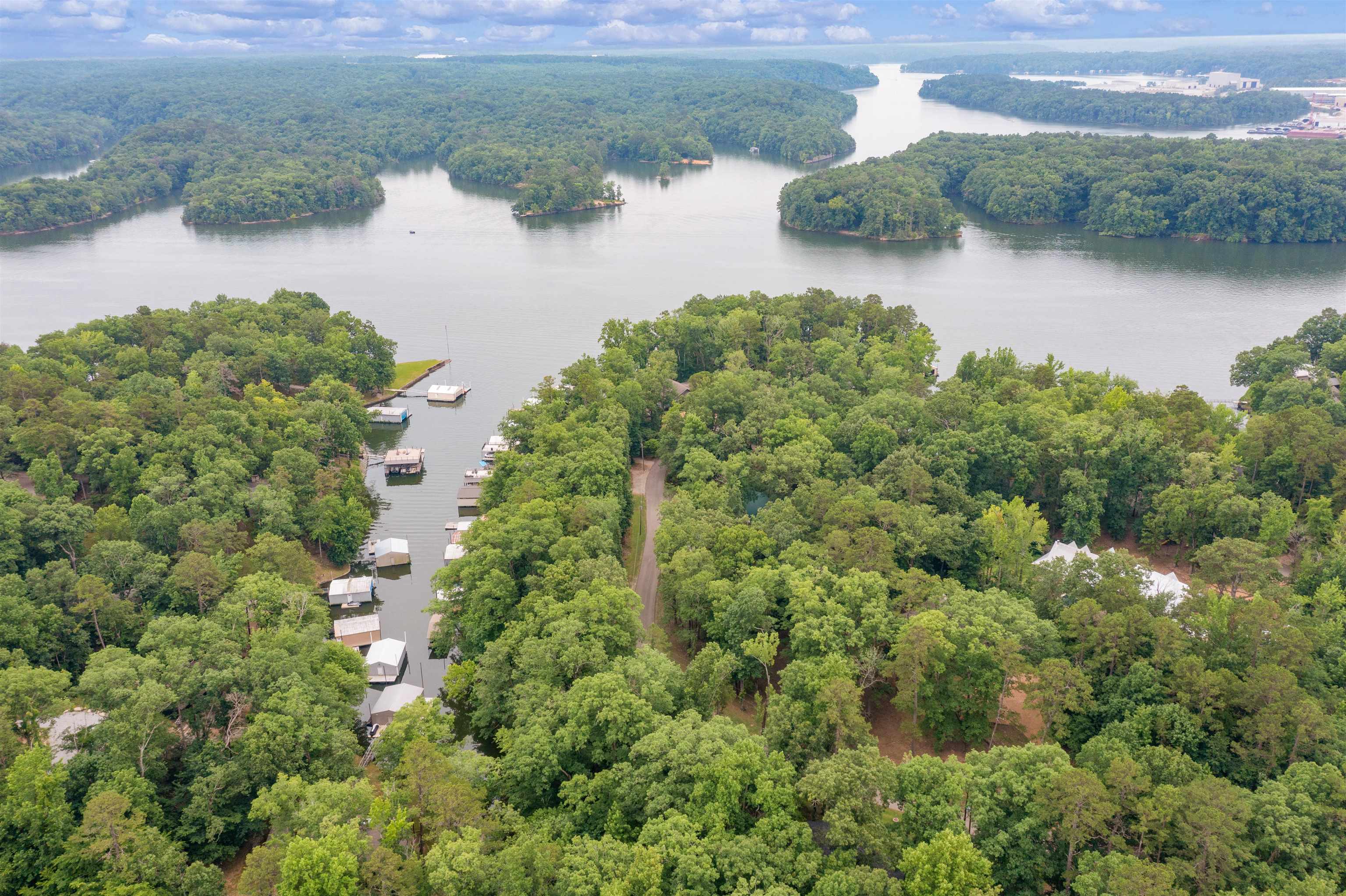 an aerial view of a houses with a lake view