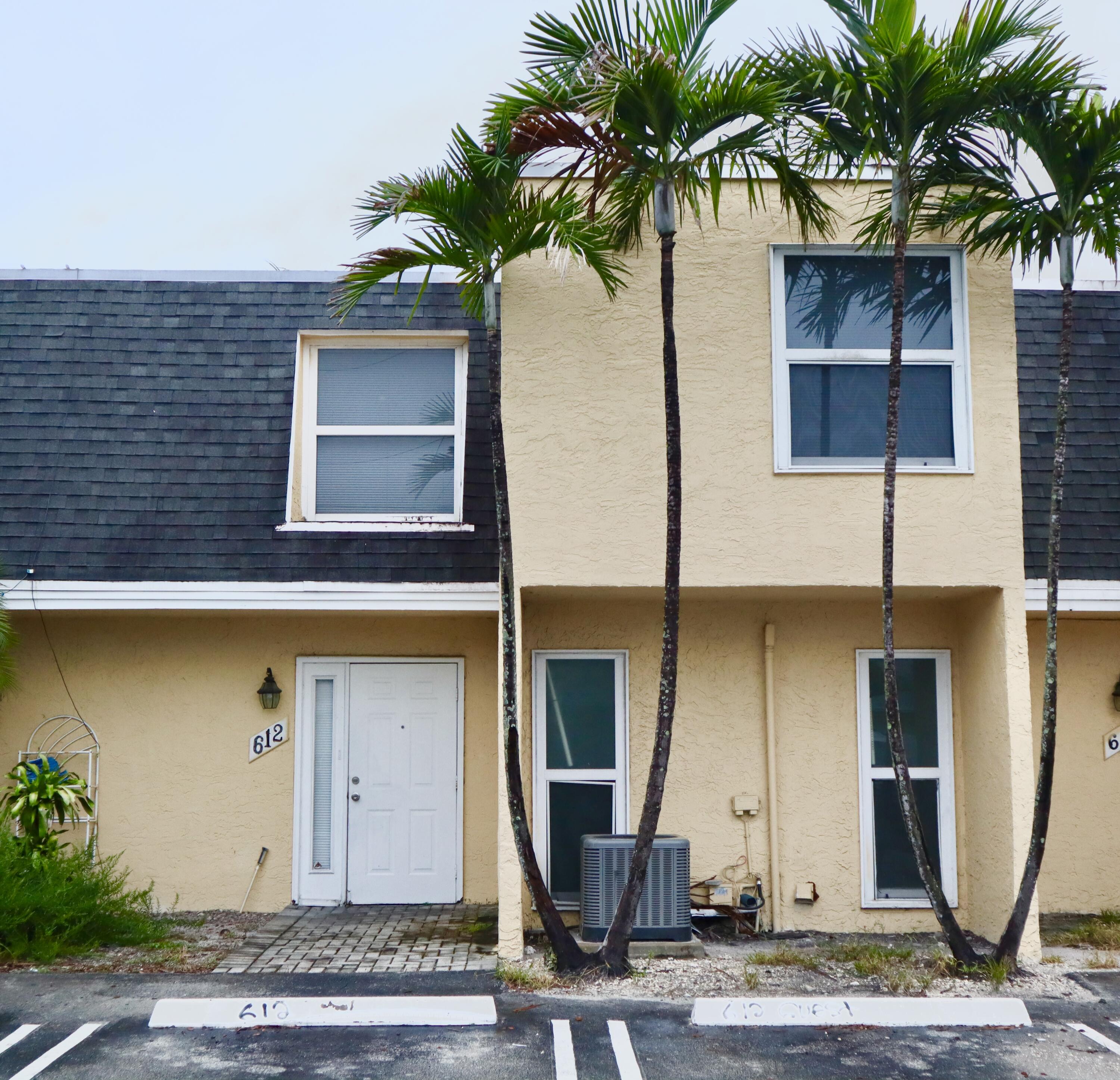 a front view of a house with yard