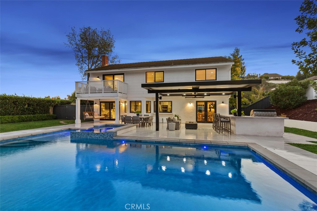 a front view of house with yard and outdoor seating