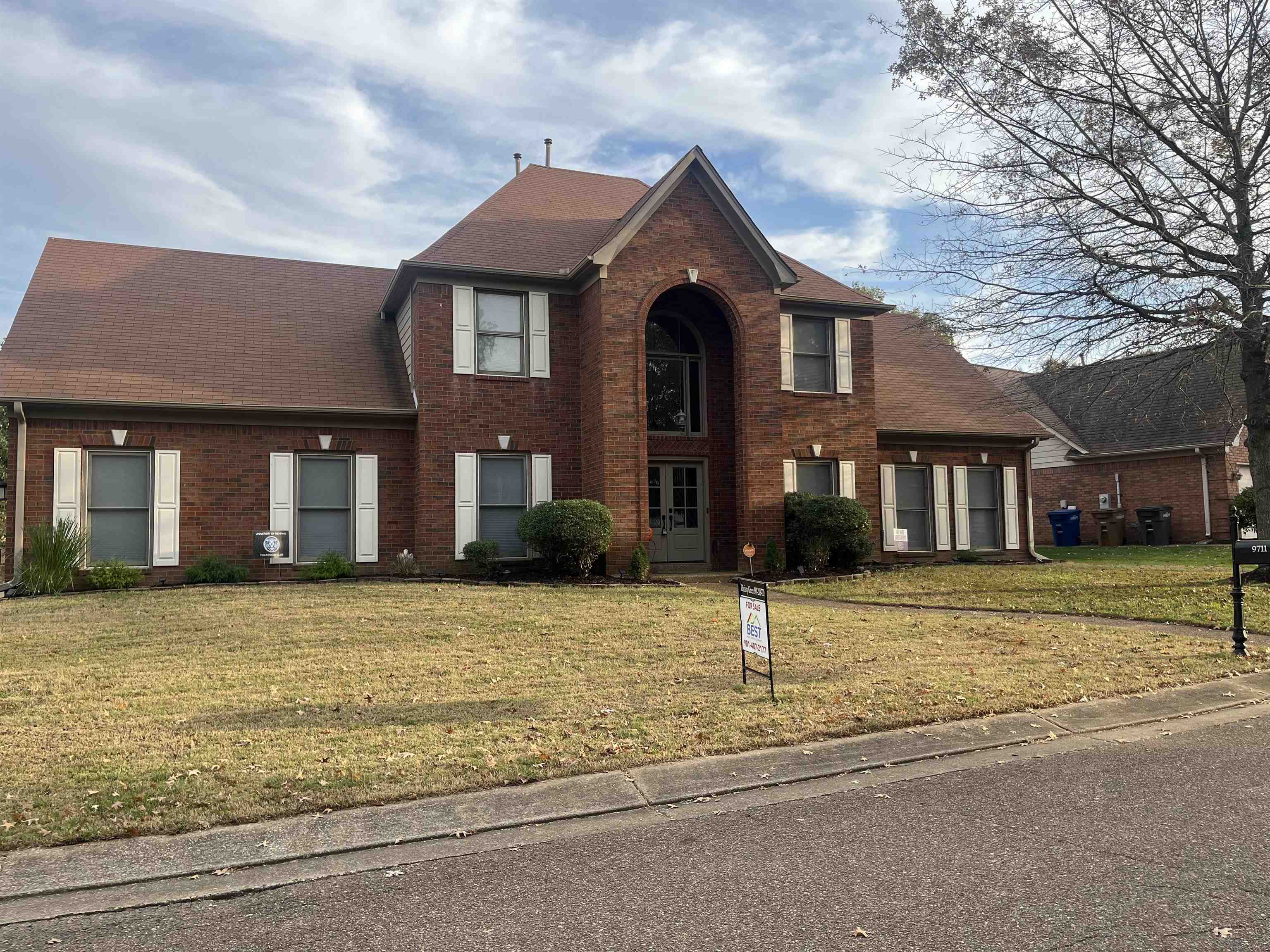 a front view of a house with a yard