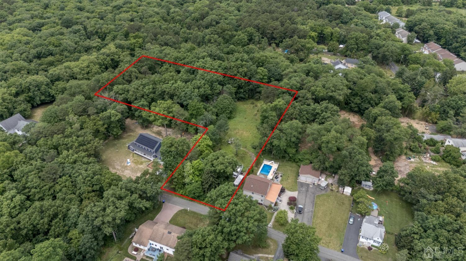 an aerial view of a house with outdoor space and street view