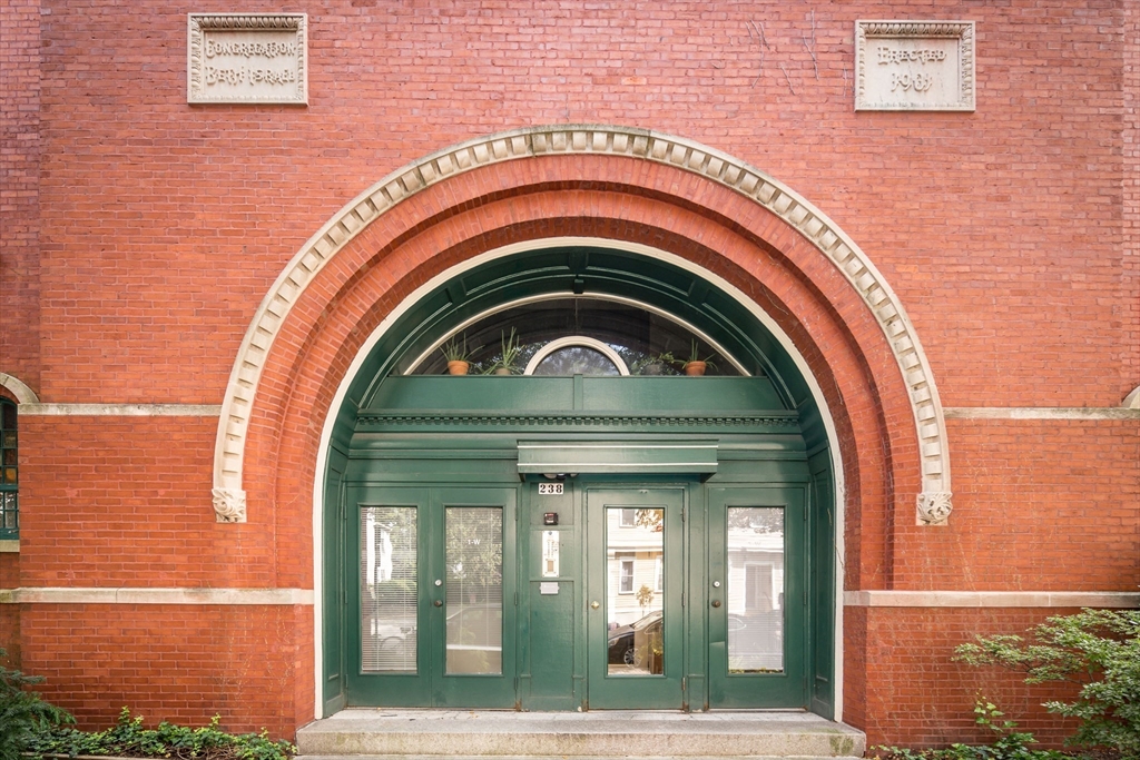 a close view of a wooden door with a outdoor space