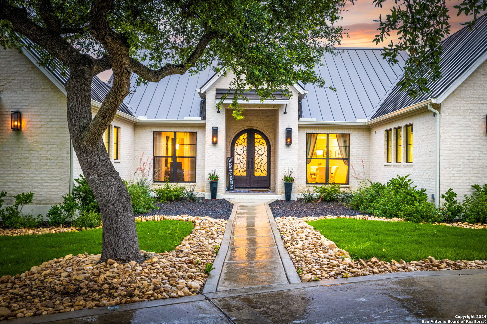 a front view of a house with garden