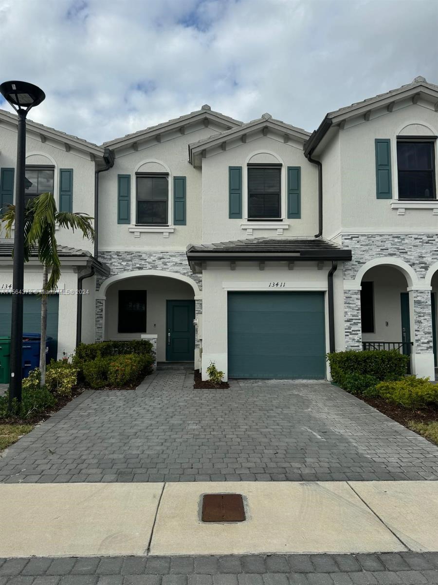 a front view of a house with yard