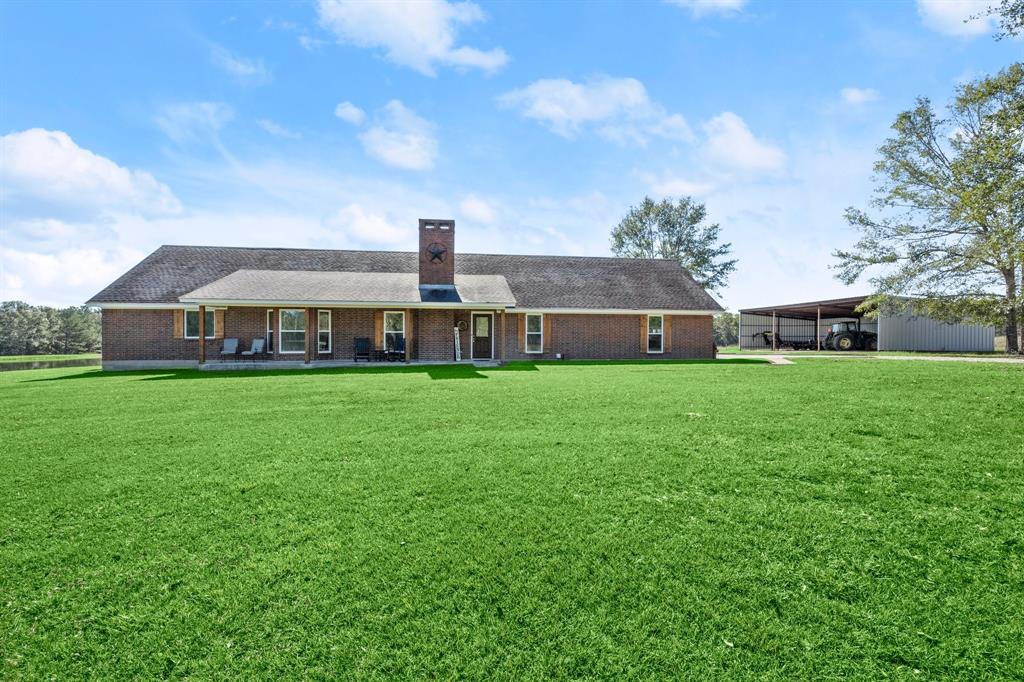 a view of a house with a big yard