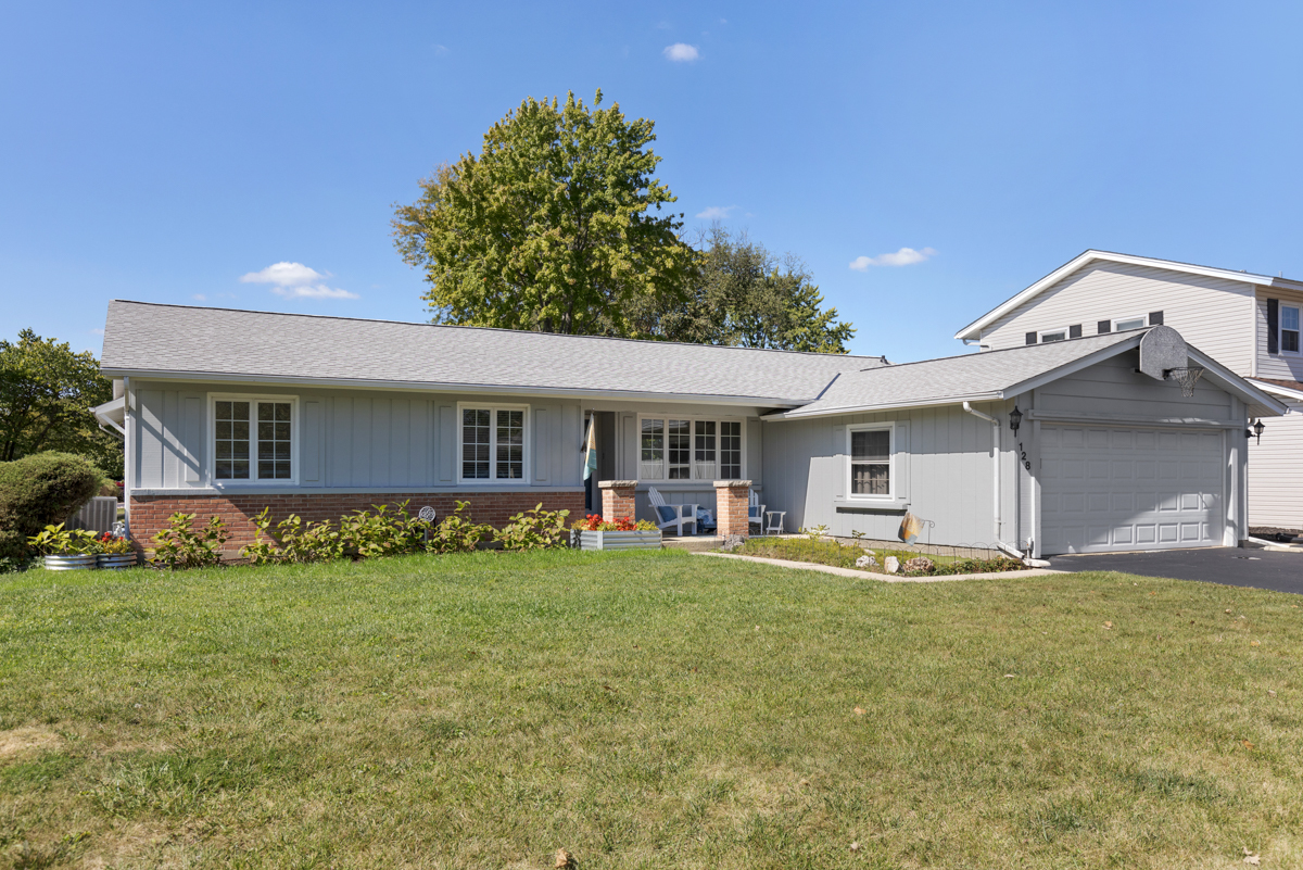 a front view of house with yard and seating area