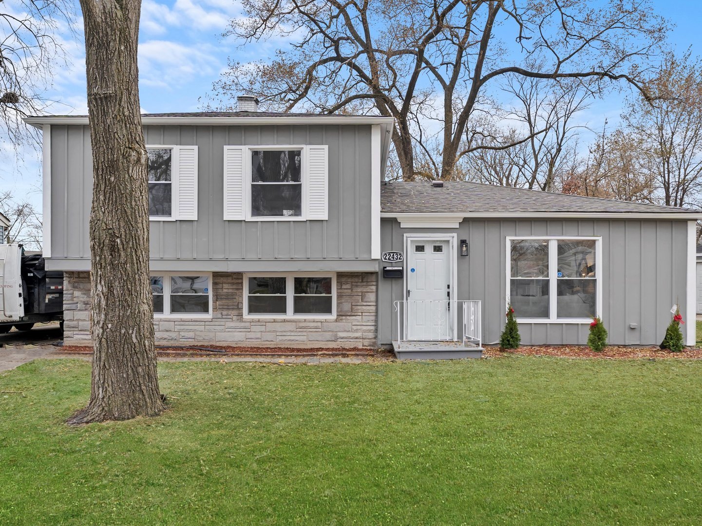 a front view of a house with a yard