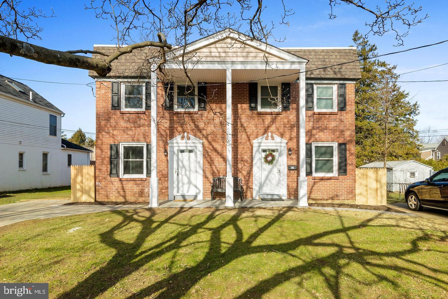 a view of a brick house with many windows